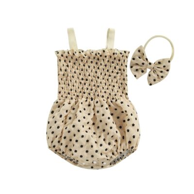 Elegant beige romper with black suede flower and matching headband